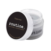 r
routine Superstar deodorant jar opened showing dark grey cream texture - activated charcoal and prebiotic formula with warm tonka sage scent for sensitive skin